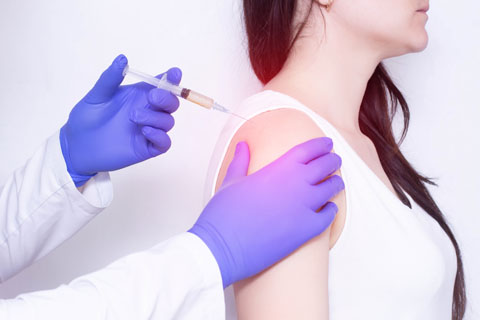 Female getting stem cell therapy in shoulder